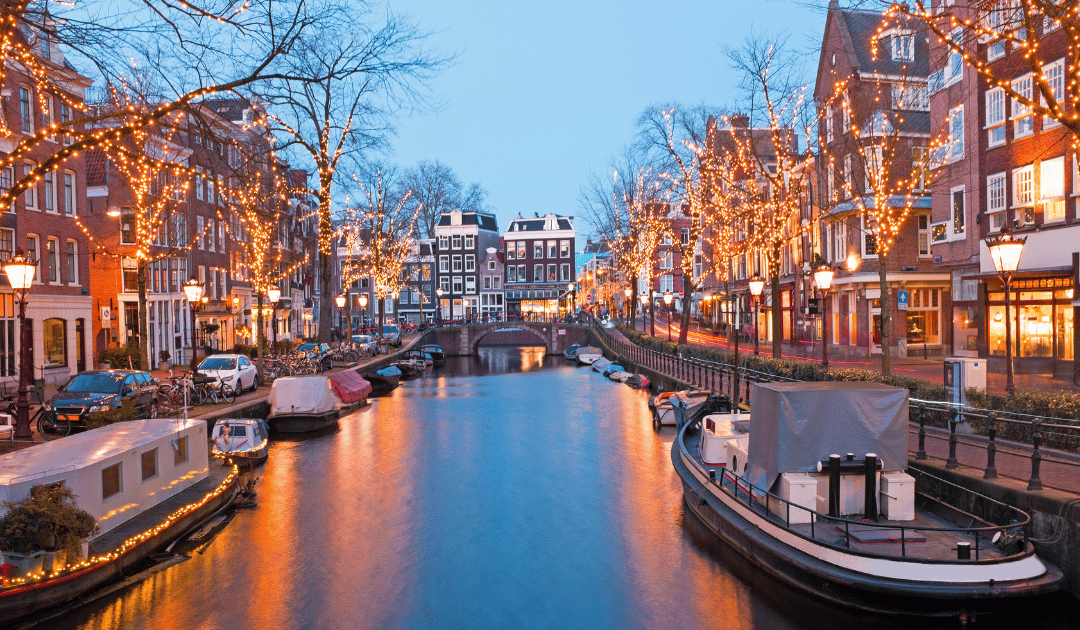 Amsterdam canals at night, one of the best cities in Europe for an Erasmus-style weekend trip Amsterdam canals at night, one of the best cities in Europe for an Erasmus-style weekend trip